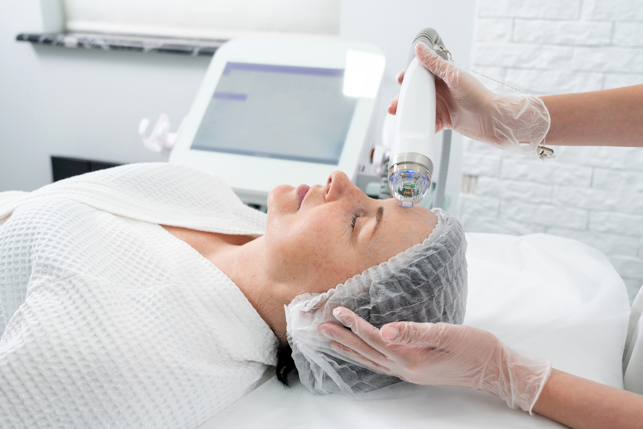 Mature Woman Receiving Laser Treatment In Cosmetology Clinic
